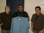 Chief Gray receives a KORI shirt from Brian and Wes