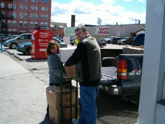 Heather and Brian unloading books from Sterling Hall School 004